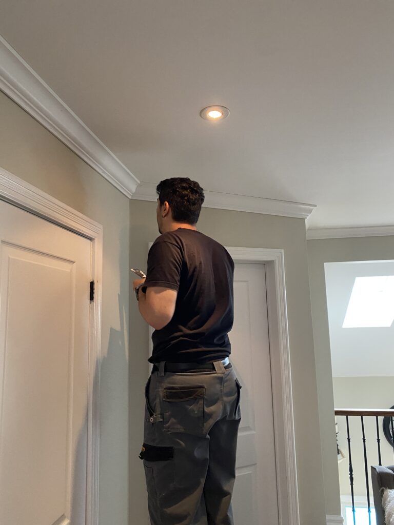 the finish carpenter working on a crown molding installation in Oakville